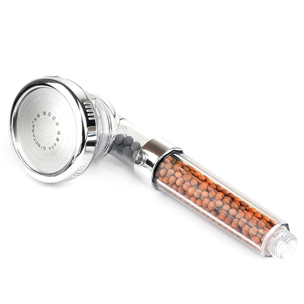 An old shower head with a weak stream
